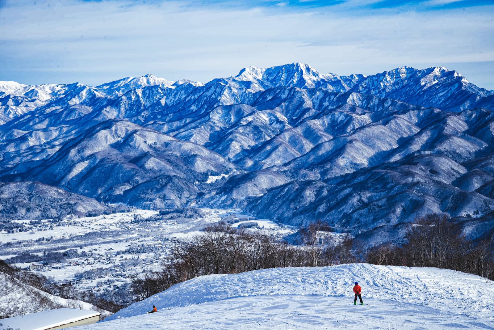 Snow-covered Hakuba ski slopes looking across the valley to the Northern Alps
